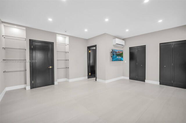 4430 Casper Ct, Hollywood, FL 33021 - unfurnished bedroom with a wall mounted AC, recessed lighting, baseboards, and multiple closets