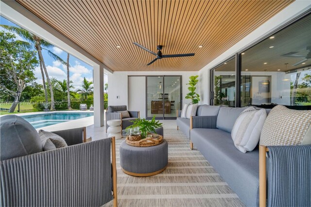 4430 Casper Ct, Hollywood, FL 33021 - view of patio / terrace featuring ceiling fan, an outdoor living space, and an outdoor pool