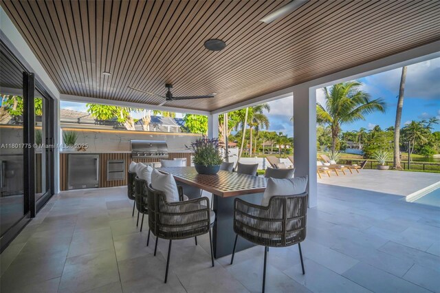 4430 Casper Ct, Hollywood, FL 33021 - view of patio / terrace featuring an outdoor kitchen, a grill, outdoor dining area, and a ceiling fan