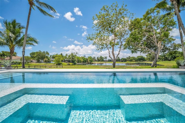 4430 Casper Ct, Hollywood, FL 33021 - view of swimming pool with a water view and a pool with connected hot tub