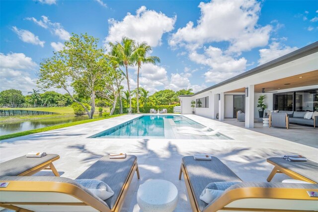 4430 Casper Ct, Hollywood, FL 33021 - swimming pool featuring a patio, outdoor lounge area, a water view, and view of wooded area