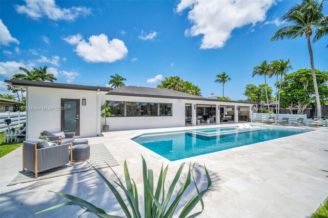 4430 Casper Ct, Hollywood, FL 33021 - view of swimming pool with a patio, a pool with connected hot tub, and an outdoor living space