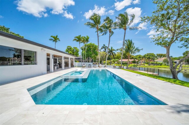 4430 Casper Ct, Hollywood, FL 33021 - view of swimming pool with a patio, a water view, and a pool with connected hot tub