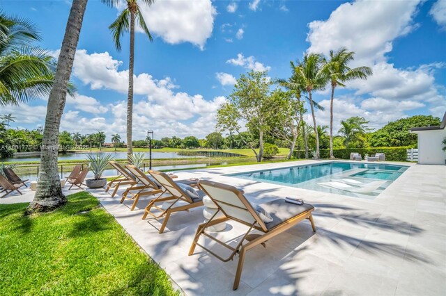 4430 Casper Ct, Hollywood, FL 33021 - outdoor pool with a water view, a patio, and a yard