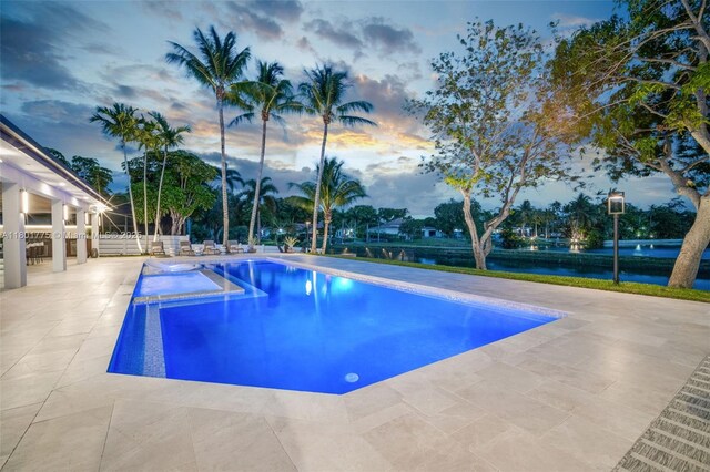 4430 Casper Ct, Hollywood, FL 33021 - pool at dusk with an outdoor pool, a patio, and a water view