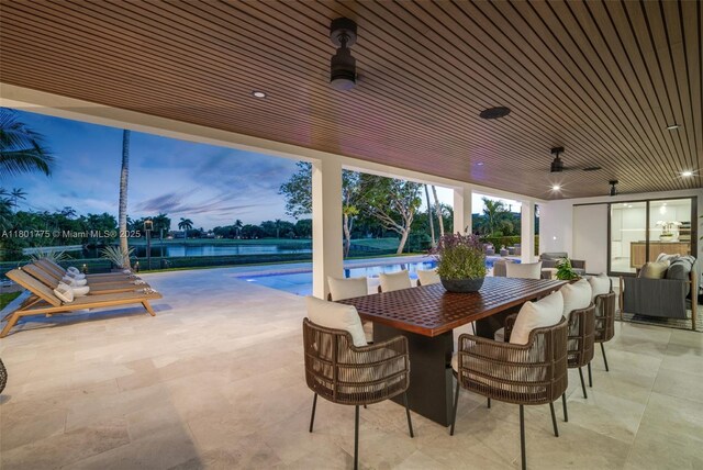 4430 Casper Ct, Hollywood, FL 33021 - patio terrace at dusk with an outdoor pool, a ceiling fan, and an outdoor living space