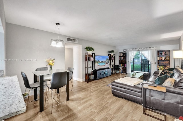 8504 Old Country Mnr Unit 205, Davie, FL 33328 - living room with baseboards and light wood-type flooring