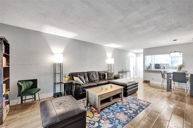 8504 Old Country Mnr Unit 205, Davie, FL 33328 - living area with wood tiled floors, a textured ceiling, and baseboards