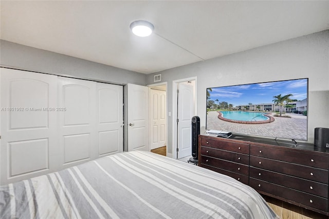 8504 Old Country Mnr Unit 205, Davie, FL 33328 - bedroom with a closet and wood finished floors