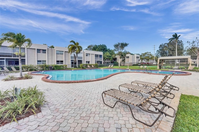 8504 Old Country Mnr Unit 205, Davie, FL 33328 - community pool with a patio area and fence