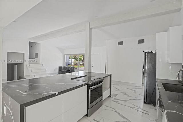 2548 Tortugas Ln, Fort Lauderdale, FL 33312 - kitchen with stainless steel appliances, a sink, modern cabinets, and white cabinets