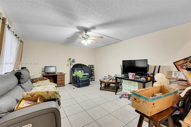 1458 N Lawnwood Cir Unit 24, Fort Pierce, FL 34950 - living area featuring ceiling fan, light tile patterned floors, and a textured ceiling