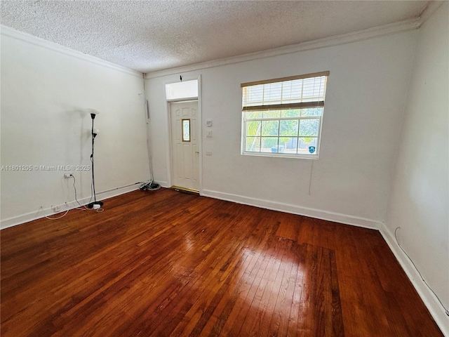 5834 SW 66th St, South Miami, FL 33143 - entrance foyer featuring dark wood finished floors, ornamental molding, a textured ceiling, and baseboards