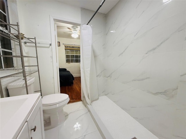 5834 SW 66th St, South Miami, FL 33143 - full bath featuring marble finish flooring, a marble finish shower, toilet, vanity, and ceiling fan