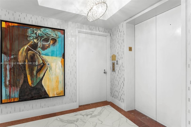 2600 Island Blvd Unit 2603, Aventura, FL 33160 - foyer entrance featuring a chandelier, marble finish floors, and elevator