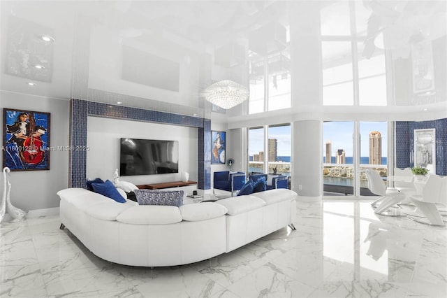 2600 Island Blvd Unit 2603, Aventura, FL 33160 - living room featuring a high ceiling, marble tiled flooring, baseboards, and recessed lighting