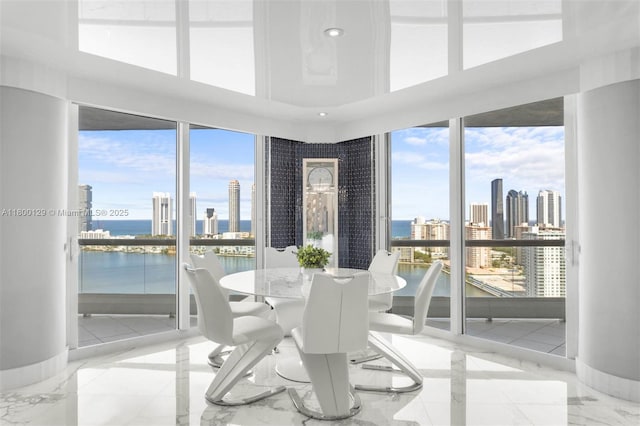 2600 Island Blvd Unit 2603, Aventura, FL 33160 - sunroom / solarium with healthy amount of natural light, a water view, and a skyline view