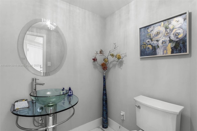2600 Island Blvd Unit 2603, Aventura, FL 33160 - bathroom with a sink, toilet, and baseboards