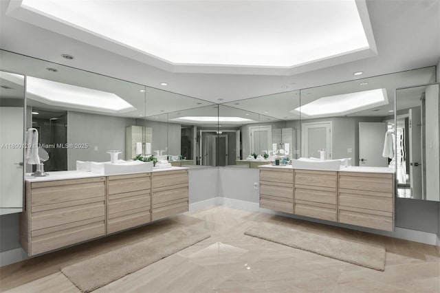 2600 Island Blvd Unit 2603, Aventura, FL 33160 - bathroom featuring a raised ceiling, two vanities, recessed lighting, a stall shower, and baseboards