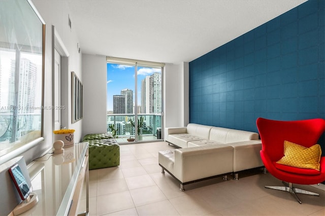 tiled living area with a skyline view, tile walls, and expansive windows