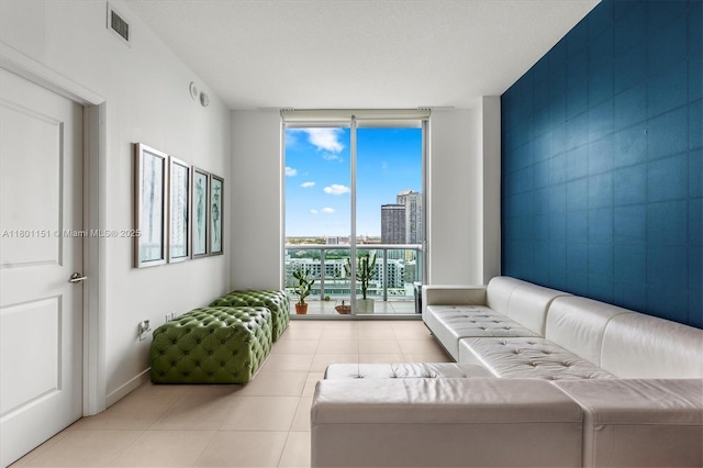 tiled living room with expansive windows and a city view