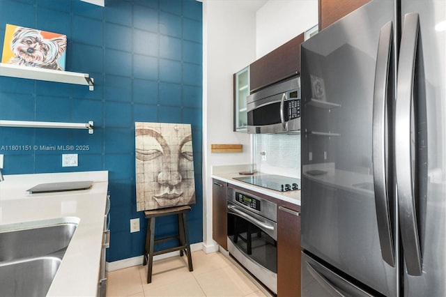 kitchen featuring stainless steel appliances, modern cabinets, light tile patterned floors, light countertops, and open shelves