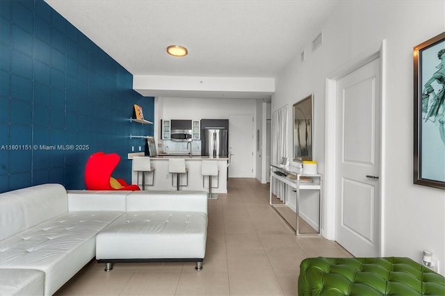 living room with light tile patterned floors