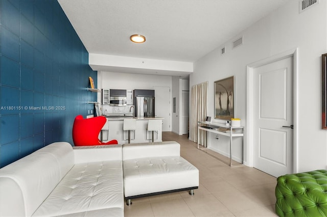 living room featuring light tile patterned flooring