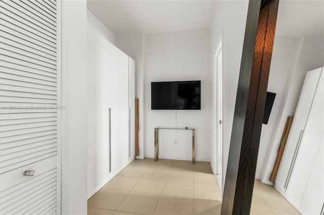 corridor with light tile patterned floors