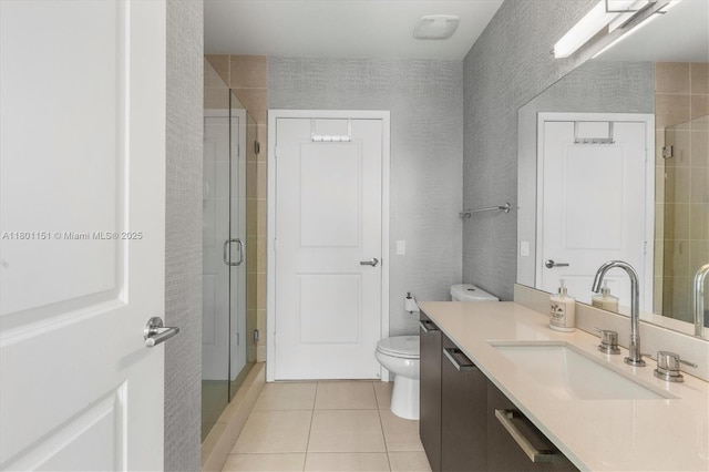 full bathroom with tile patterned floors, a shower stall, vanity, and toilet