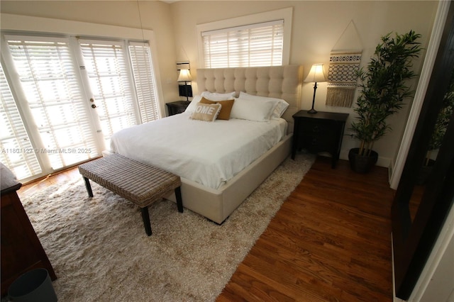 804 SE 10th St, Fort Lauderdale, FL 33316 - bedroom with wood finished floors, multiple windows, and access to outside
