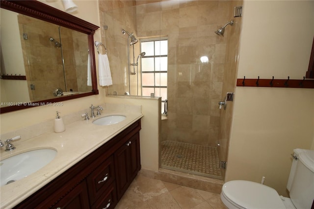 804 SE 10th St, Fort Lauderdale, FL 33316 - bathroom featuring toilet, a shower stall, double vanity, and tile patterned floors