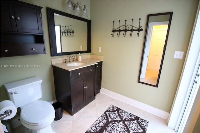 804 SE 10th St, Fort Lauderdale, FL 33316 - bathroom featuring baseboards, vanity, toilet, and tile patterned flooring