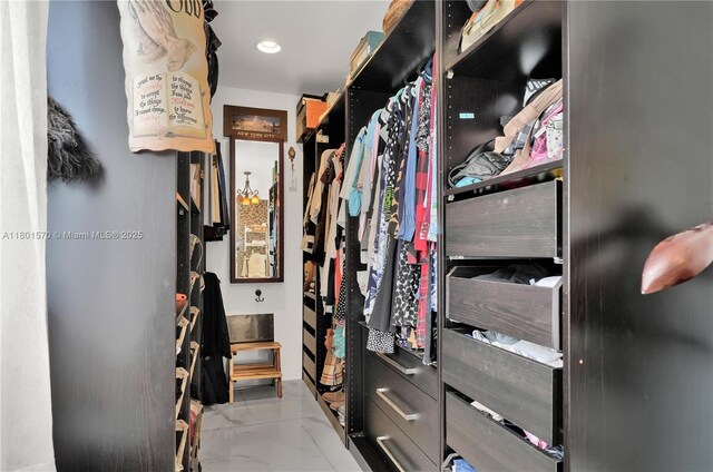 16750 NE 10th Ave Unit 314, North Miami Beach, FL 33162 - walk in closet featuring marble finish floors