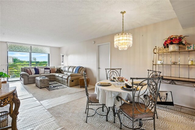 1100 Saint Charles Pl Unit 407, Pembroke Pines, FL 33026 - dining area with a chandelier and a textured ceiling