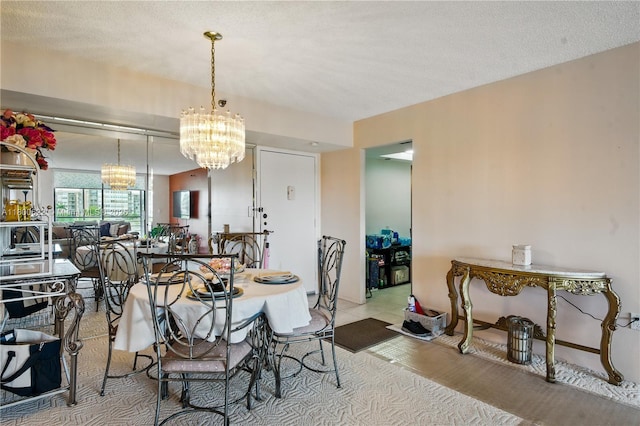 1100 Saint Charles Pl Unit 407, Pembroke Pines, FL 33026 - dining area with a chandelier and wood finished floors