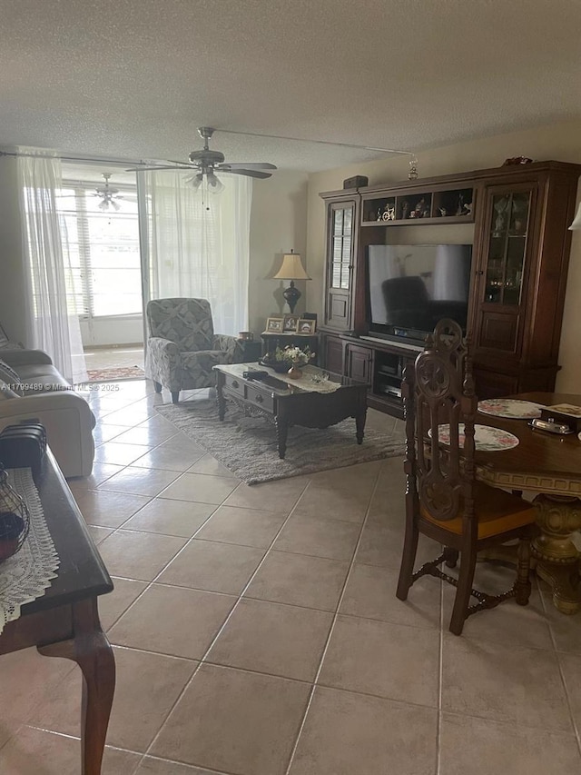 7680 NW 18th St Unit 107, Margate, FL 33063 - living room with plenty of natural light, light tile patterned floors, a textured ceiling, and ceiling fan