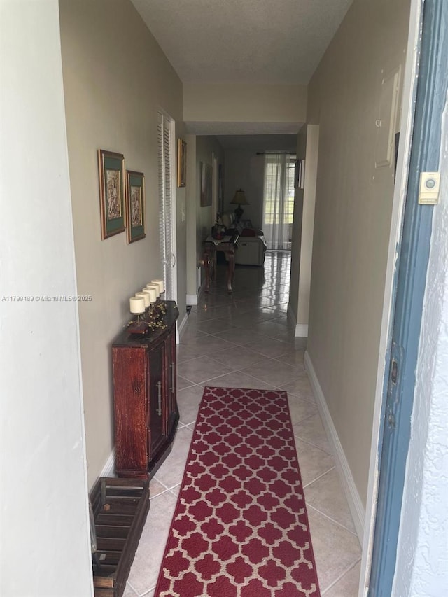 7680 NW 18th St Unit 107, Margate, FL 33063 - corridor with light tile patterned floors and baseboards