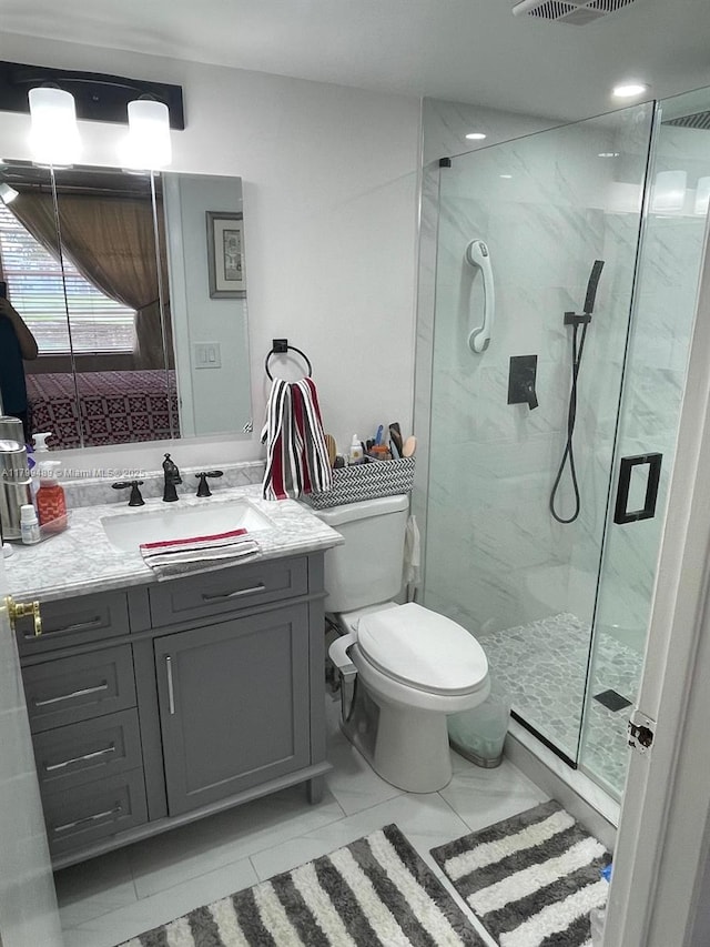 7680 NW 18th St Unit 107, Margate, FL 33063 - full bath with a marble finish shower, vanity, toilet, and tile patterned flooring