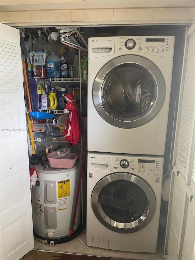 7680 NW 18th St Unit 107, Margate, FL 33063 - laundry area featuring stacked washer and clothes dryer and tile patterned floors