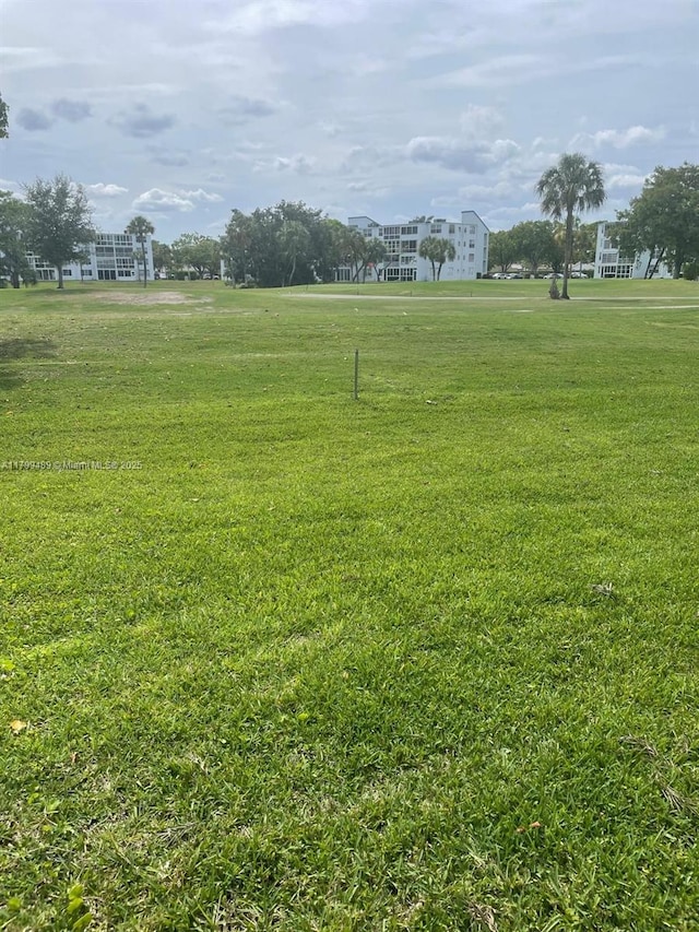 7680 NW 18th St Unit 107, Margate, FL 33063 - view of property's community with a yard