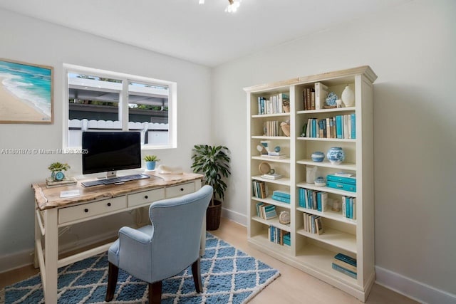 office space featuring baseboards