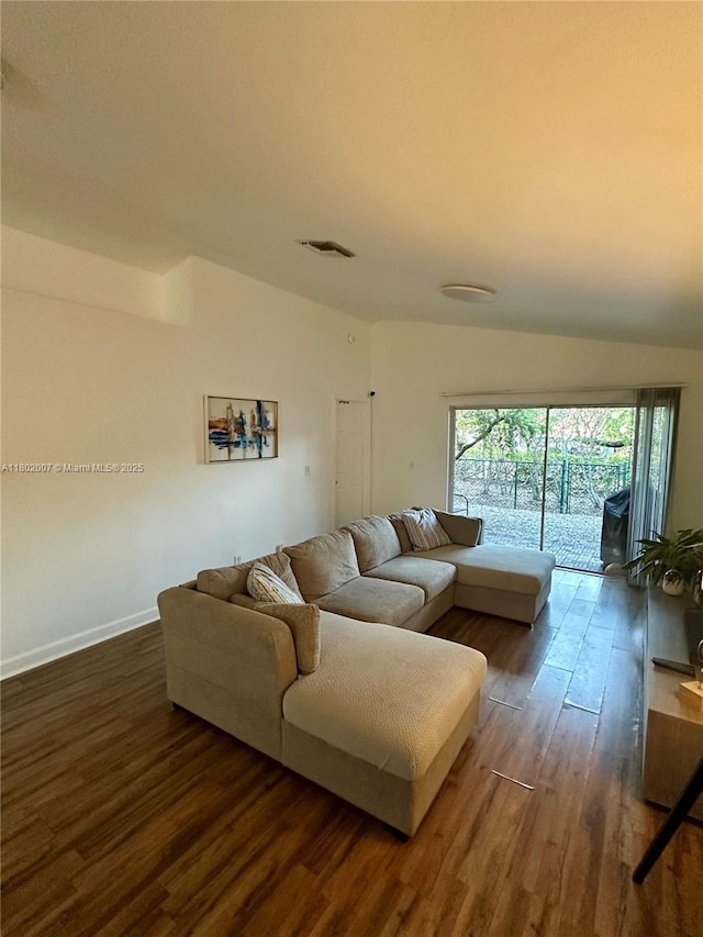 3828 NW 121st Ave, Sunrise, FL 33323 - living area featuring dark wood-type flooring, baseboards, and lofted ceiling