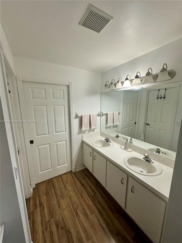 3828 NW 121st Ave, Sunrise, FL 33323 - bathroom with wood finished floors and double vanity