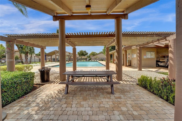 1951 SW 81st Ter, Davie, FL 33324 - view of patio / terrace with a community pool and a pergola