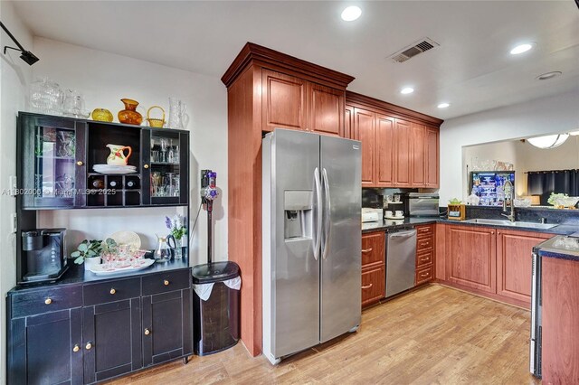 1951 SW 81st Ter, Davie, FL 33324 - kitchen featuring appliances with stainless steel finishes, a sink, light wood-type flooring, recessed lighting, and brown cabinets