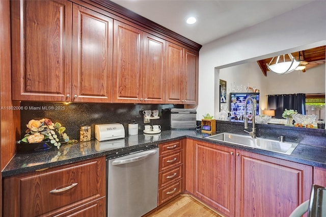 1951 SW 81st Ter, Davie, FL 33324 - kitchen featuring dishwasher, a sink, backsplash, dark stone countertops, and light wood-style floors