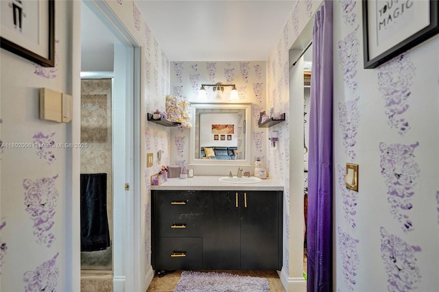 1951 SW 81st Ter, Davie, FL 33324 - bathroom with vanity, wallpapered walls, and baseboards