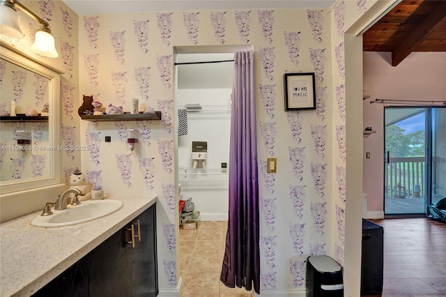 1951 SW 81st Ter, Davie, FL 33324 - bathroom with vanity, wallpapered walls, and beam ceiling
