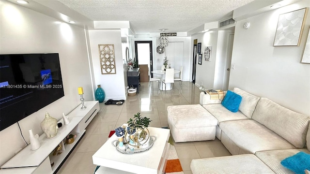 tiled living room with a textured ceiling
